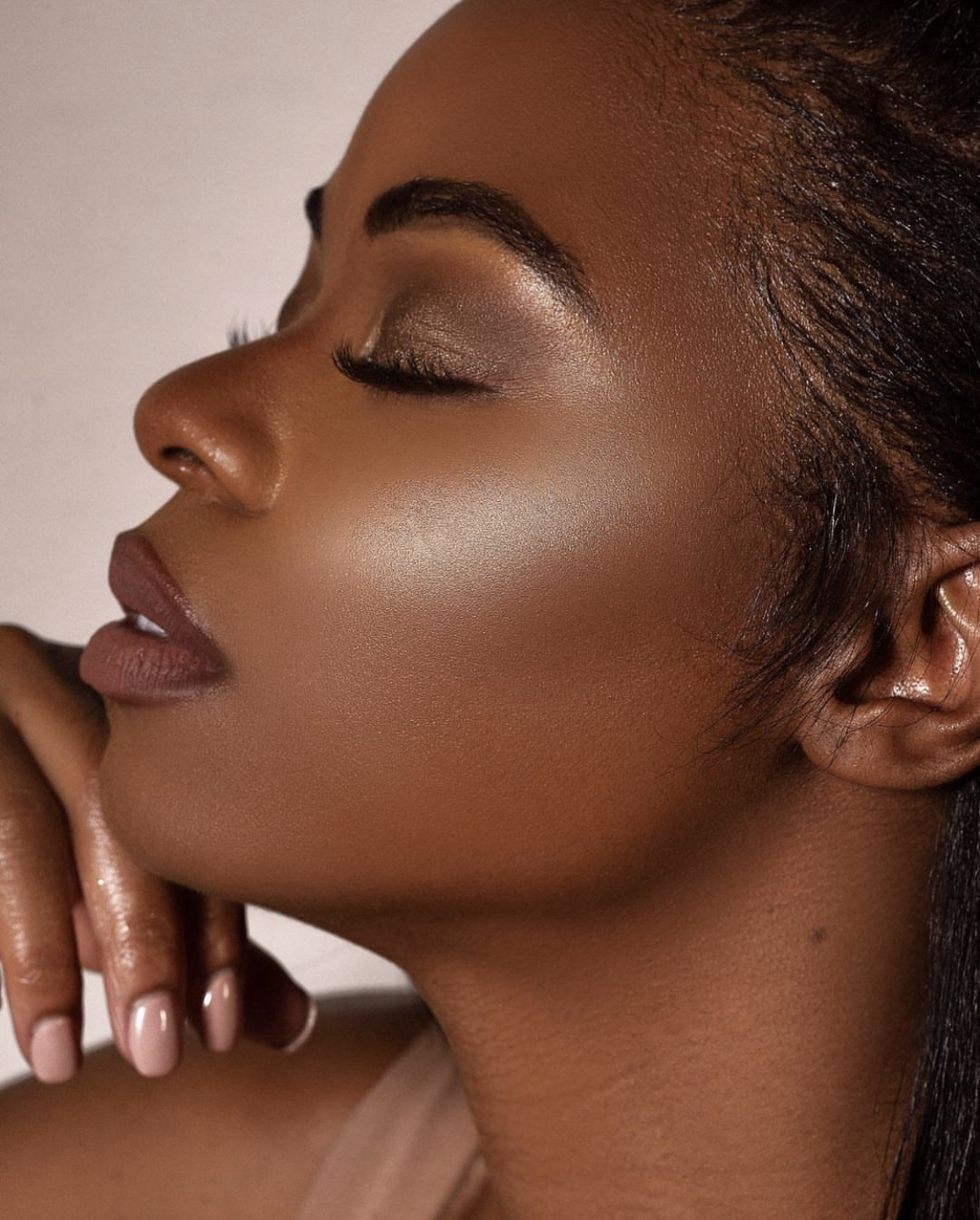Close-up of luminous, glowing skin with a dewy highlighted complexion